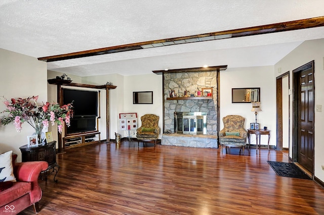 8530 Helmsman Cir, Indianapolis, IN 46256 - living room with wood finished floors, a textured ceiling, and a fireplace