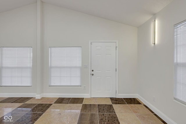 foyer featuring lofted ceiling