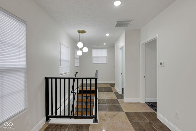 1208 W 18th St, Indianapolis, IN 46202 - corridor featuring an upstairs landing, baseboards, recessed lighting, and a textured ceiling