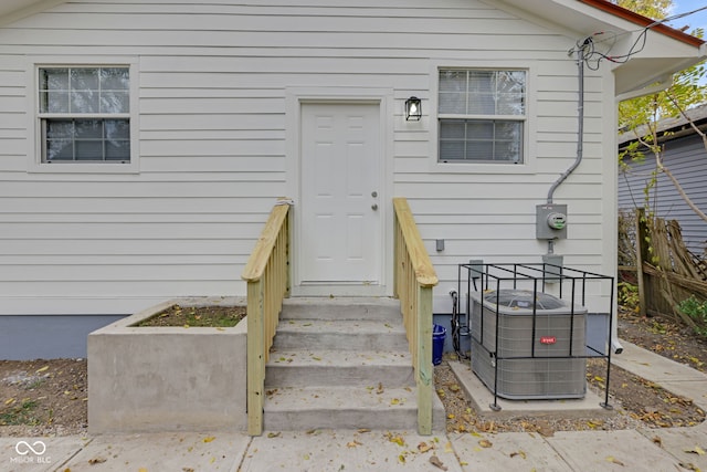 entrance to property featuring central AC unit