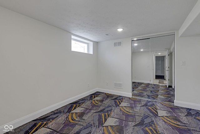 empty room with a textured ceiling