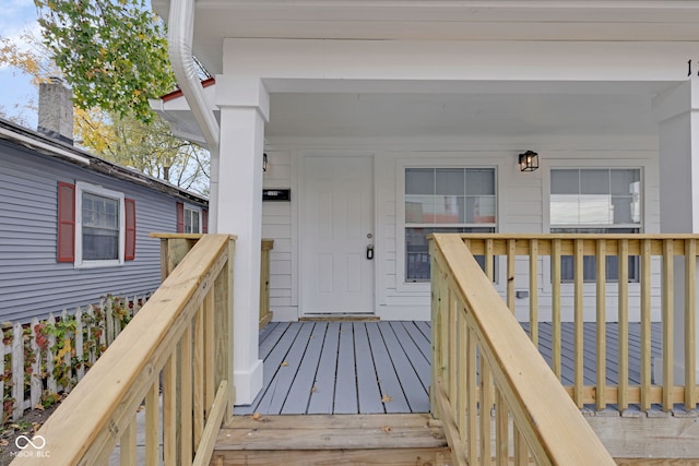 property entrance featuring a wooden deck