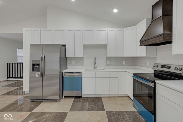 kitchen with stainless steel appliances, vaulted ceiling, custom exhaust hood, and white cabinets