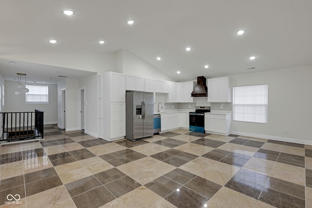 kitchen with custom exhaust hood, appliances with stainless steel finishes, white cabinetry, vaulted ceiling, and sink