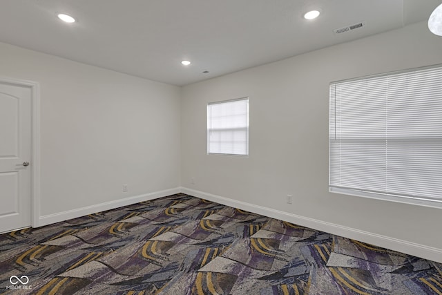 1208 W 18th St, Indianapolis, IN 46202 - carpeted empty room with recessed lighting and baseboards