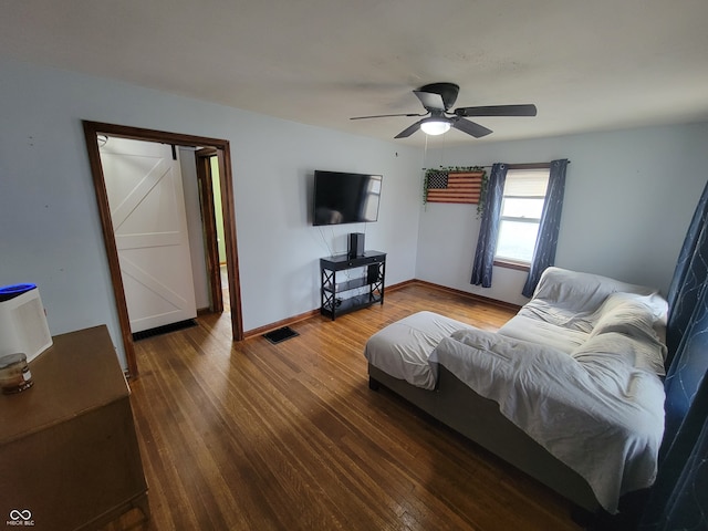 living room with ceiling fan and hardwood / wood-style flooring