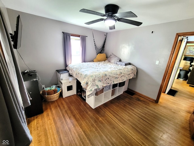 bedroom featuring hardwood / wood-style flooring and ceiling fan