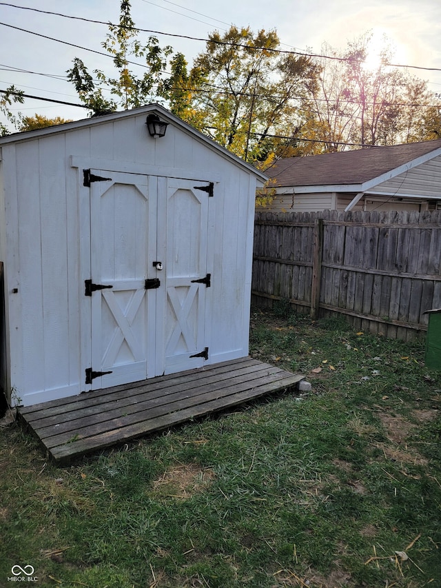 view of outbuilding featuring a lawn