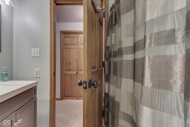 bathroom with vanity and walk in shower