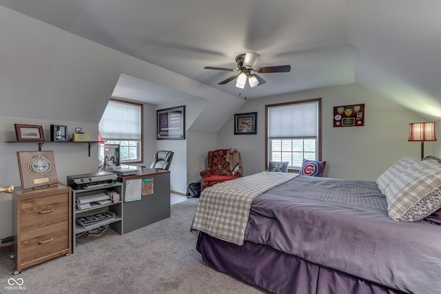 bedroom with lofted ceiling, light colored carpet, and ceiling fan