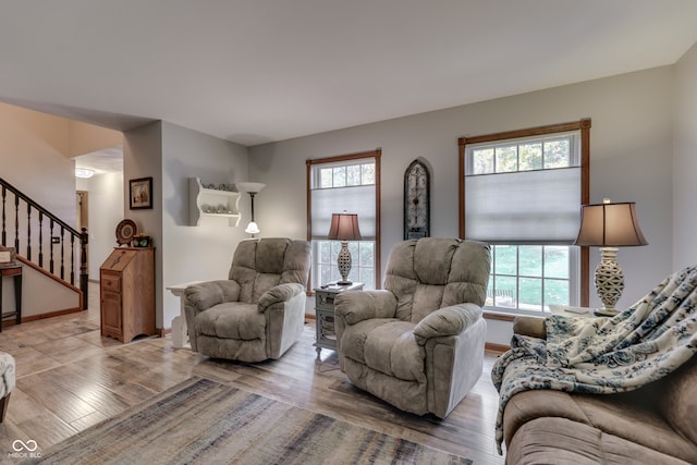 6971 Lynx Dr, Nineveh, IN 46164 - living area featuring light wood-type flooring, baseboards, plenty of natural light, and stairway