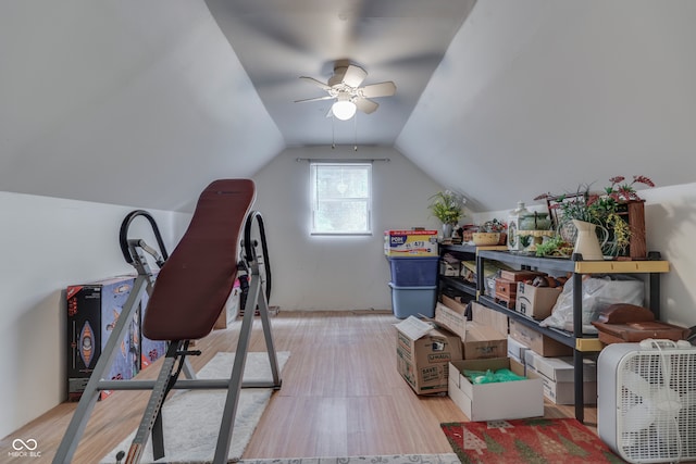 exercise area featuring ceiling fan and lofted ceiling