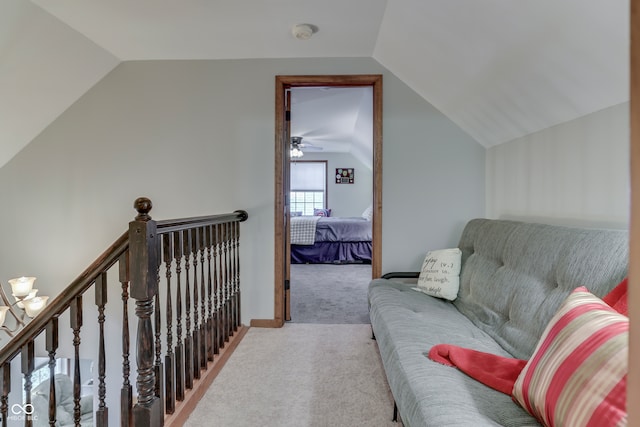 interior space featuring lofted ceiling and light colored carpet