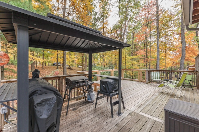 wooden terrace with a gazebo and grilling area