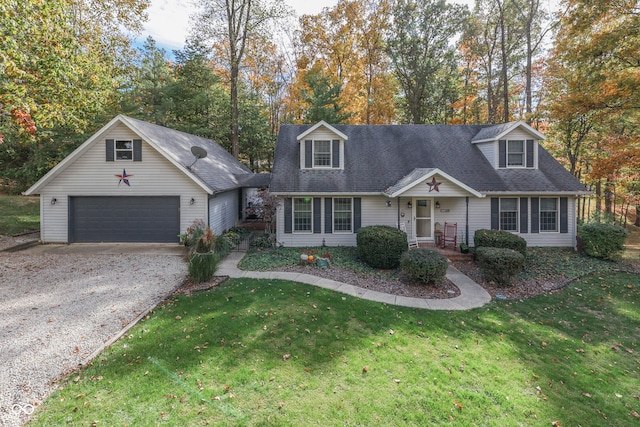 cape cod-style house with a front yard and a garage