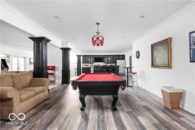 rec room with decorative columns, dark hardwood / wood-style flooring, pool table, and ornamental molding