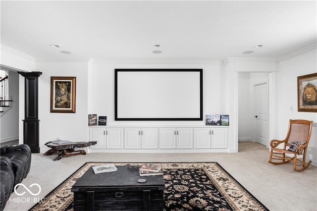 carpeted home theater room with ornamental molding