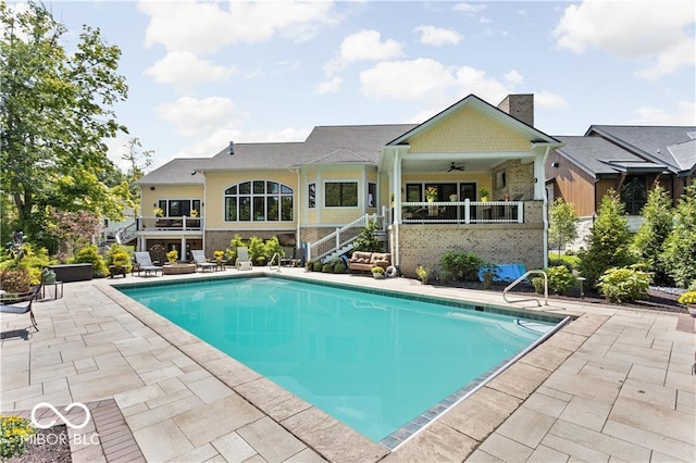 view of pool featuring a patio area and ceiling fan