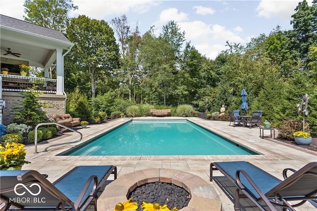 view of pool with a patio and ceiling fan