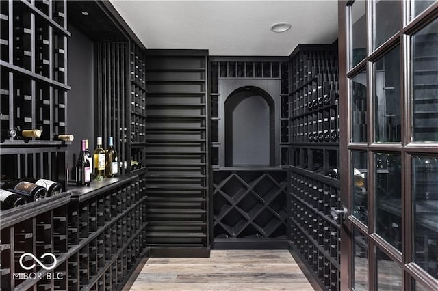 wine area featuring a textured ceiling and hardwood / wood-style flooring