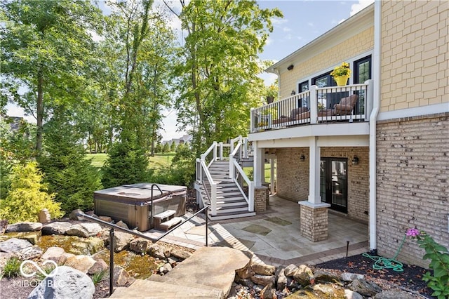 view of patio / terrace with a hot tub