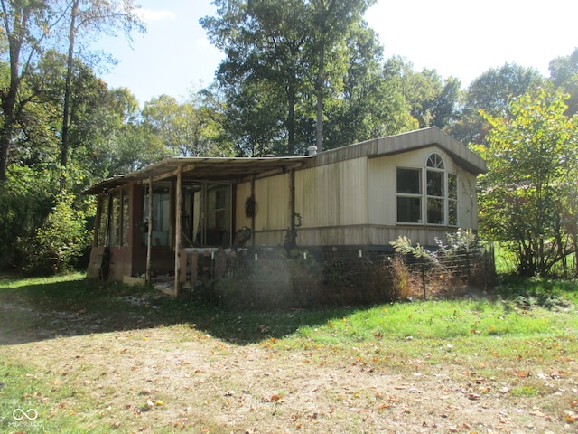 view of property exterior featuring a yard