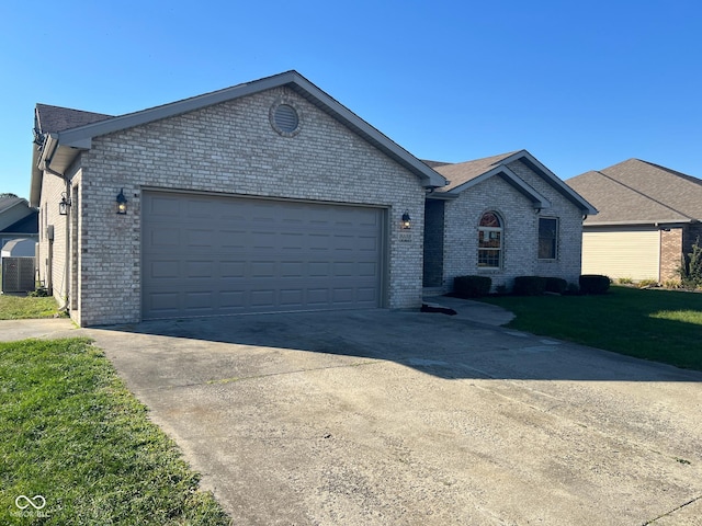 single story home featuring central AC unit and a garage