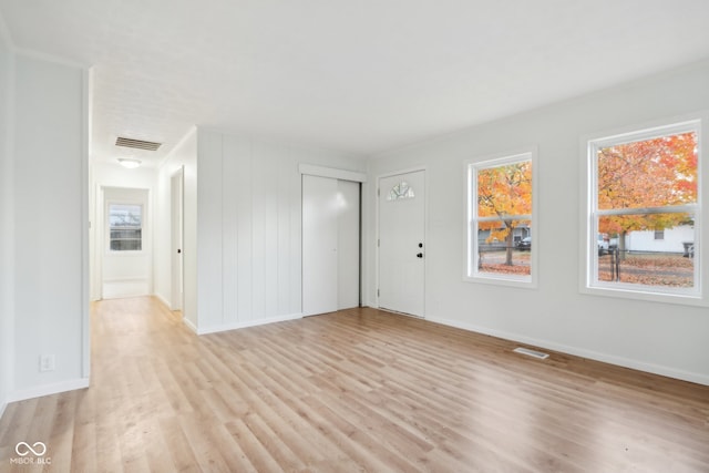 spare room with light hardwood / wood-style flooring