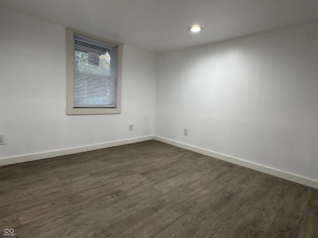 spare room featuring dark hardwood / wood-style flooring