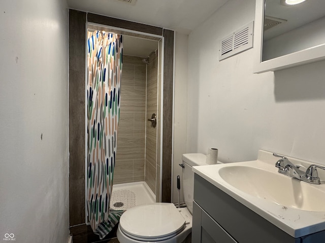 bathroom featuring vanity, toilet, and a shower with curtain