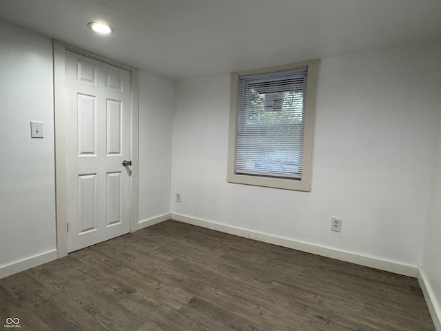 spare room featuring dark hardwood / wood-style floors