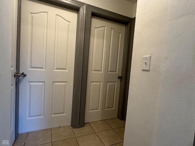 hallway with light tile patterned floors