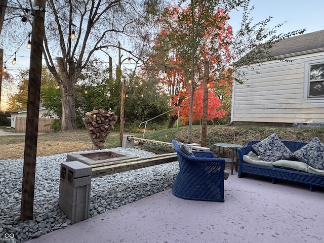 view of patio with a fire pit