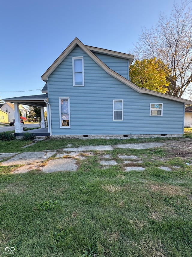 view of home's exterior featuring a lawn