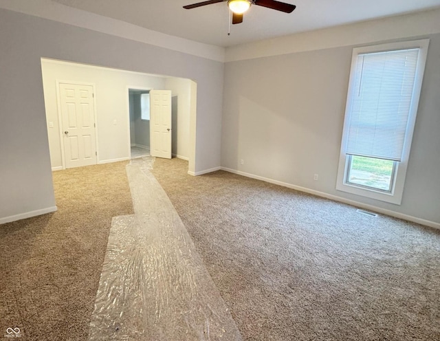 carpeted empty room with ceiling fan