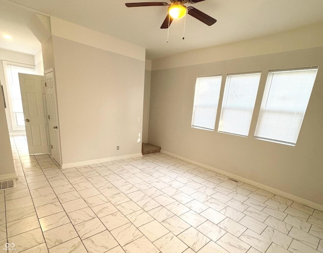 spare room with ceiling fan