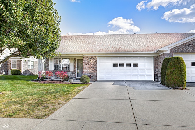 ranch-style home with a front yard and a garage