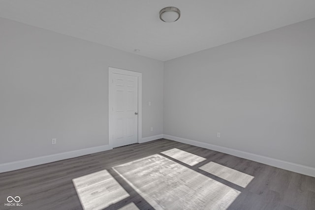 empty room featuring wood-type flooring