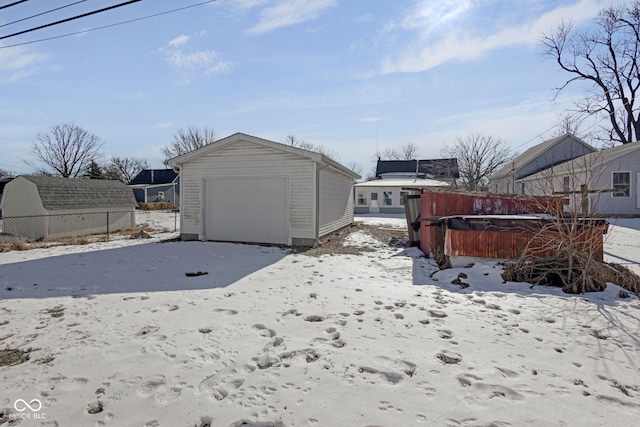 exterior space featuring a garage and an outdoor structure