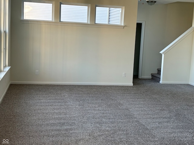 spare room with carpet flooring and ceiling fan