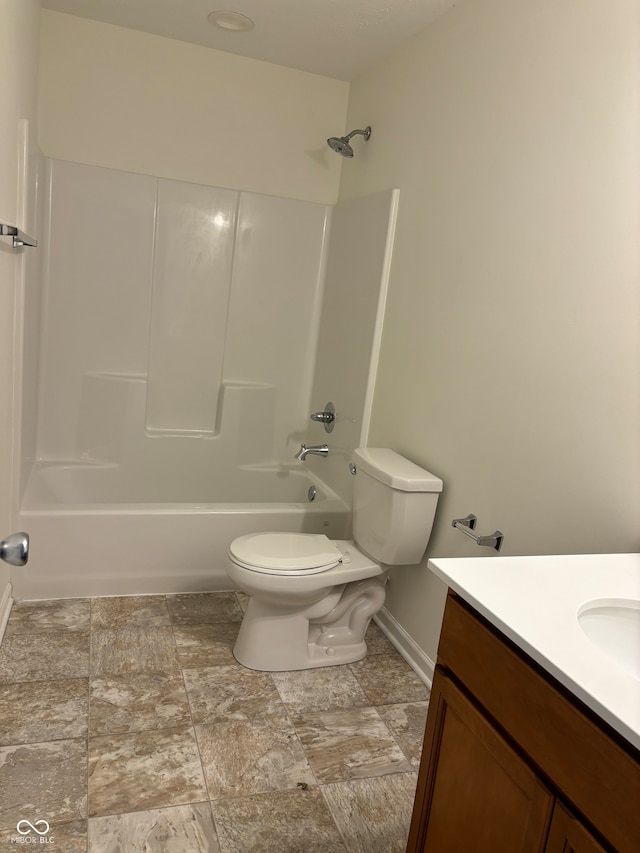 full bathroom with vanity, toilet, and washtub / shower combination