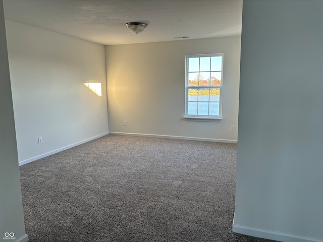 unfurnished room featuring carpet floors