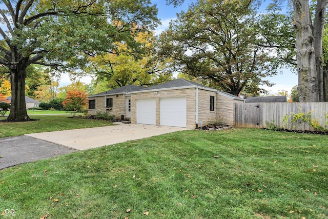 view of front of house with a garage and a front yard