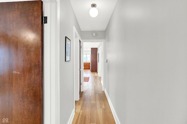 hall with light wood-type flooring