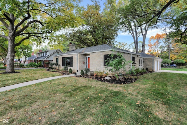 view of front of property with a garage and a front yard