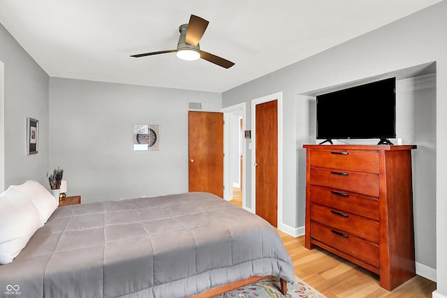 bedroom featuring ceiling fan and light hardwood / wood-style flooring