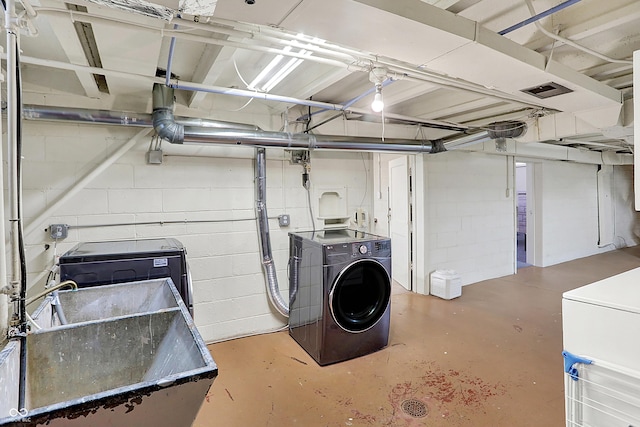 laundry room featuring washing machine and dryer