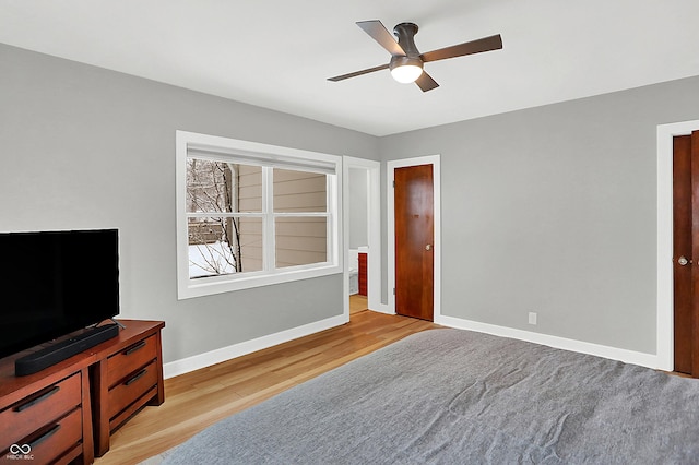 bedroom featuring ceiling fan and light hardwood / wood-style flooring