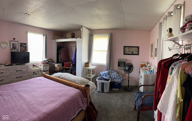 bedroom featuring carpet flooring and heating unit