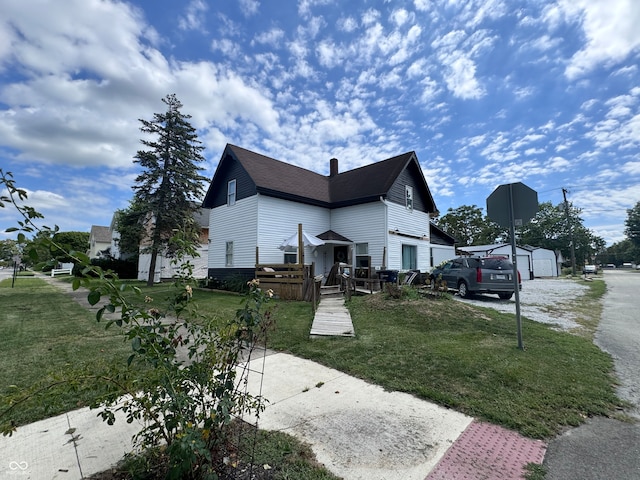 view of property exterior featuring a yard and a garage